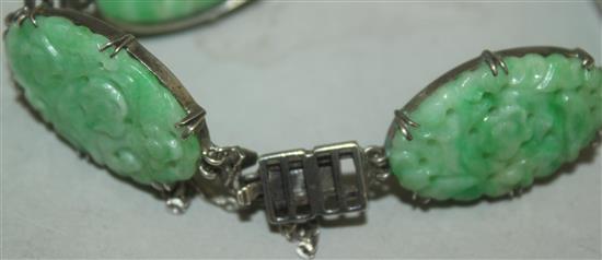 A Chinese jadeite and silver mounted bracelet, 20th century, each jadeite plaque approx. 2.5cm